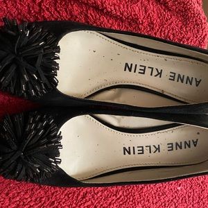 Black heels with a Pom Pom